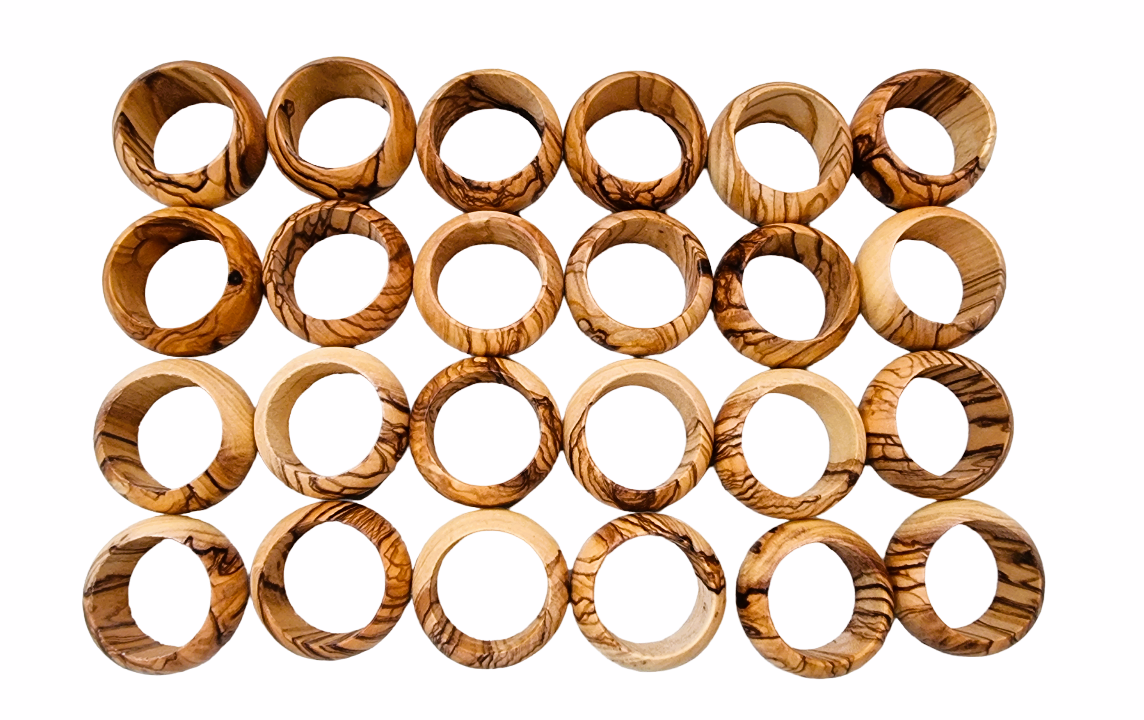 Large Amount Of Olive Wood Napkin Rings On Display.