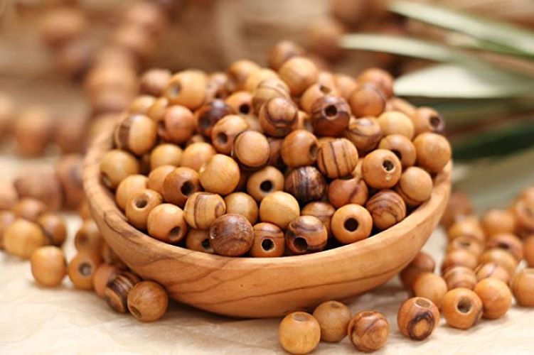 Small Wooden Tub Holding Round Olive Wood Beads From Bethlehem.