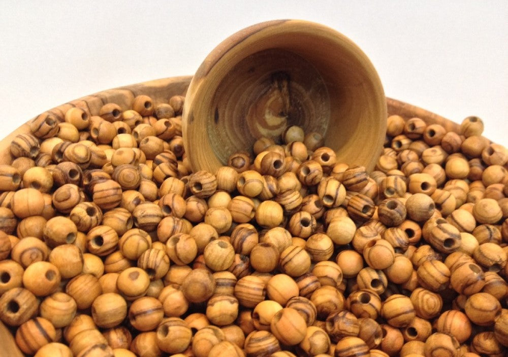 Combination of Olive Wood Beads In A Tub.