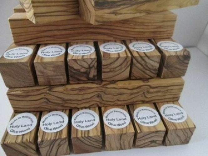 Stack Of Bethlehem Olive Wood Pen Turning Blanks With Product Sticker.