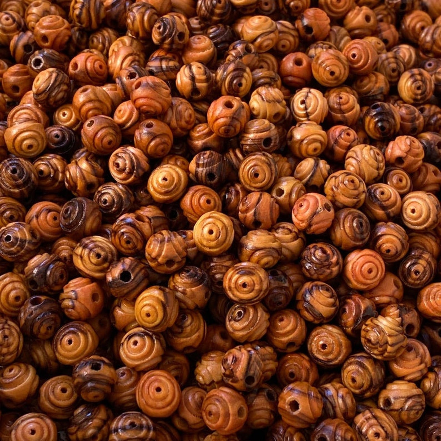 Up Close View Of Carved Olive Wood Beads From Bethlehem. 