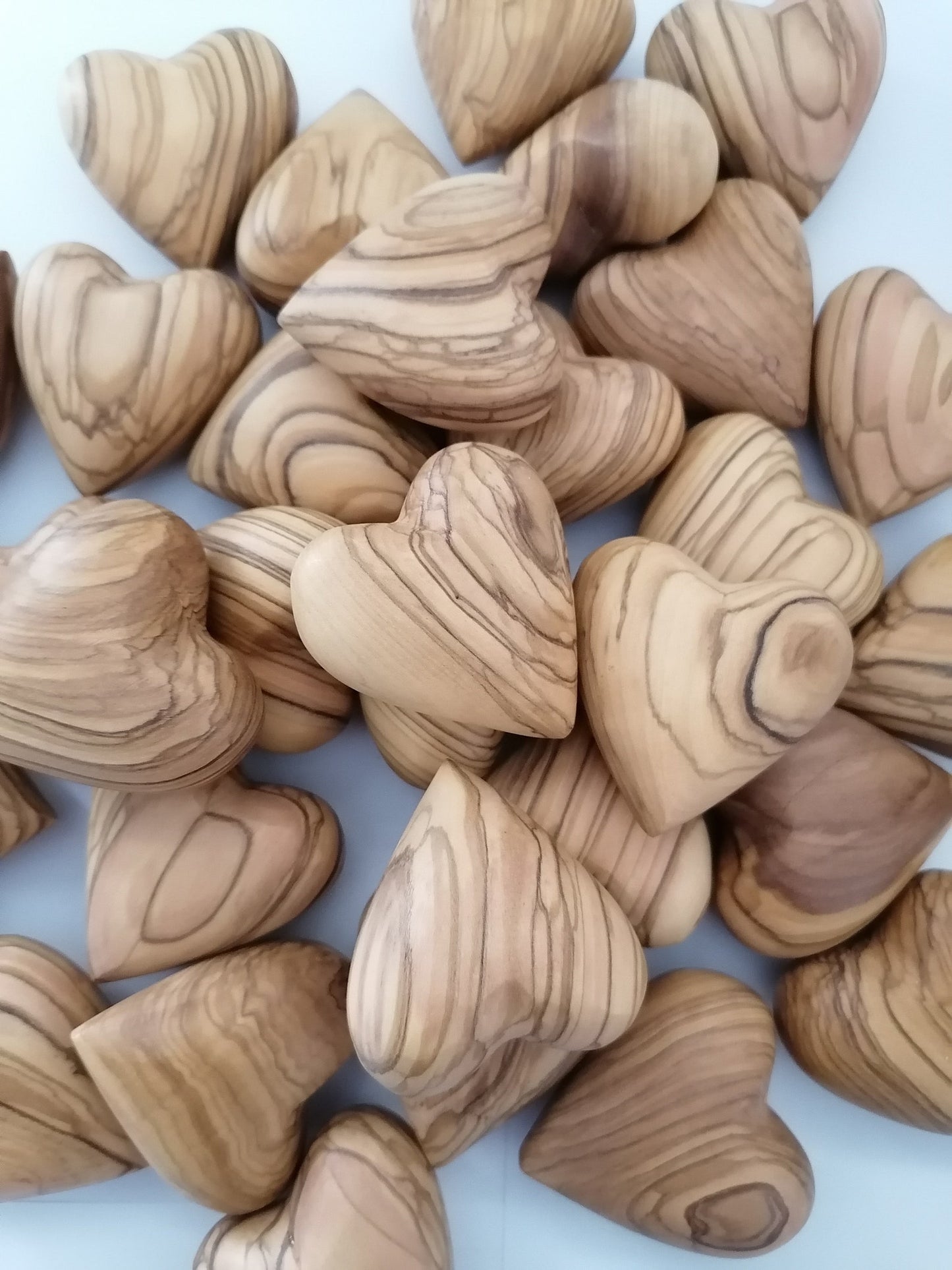 A Stack Of Olive Wood Hearts From Bethlehem.